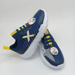 Deportivo Munich Jony Kid en azul y amarillo