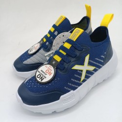 Deportivo Munich Jony Kid en azul y amarillo