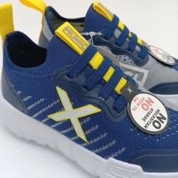 Deportivo Munich Jony Kid en azul y amarillo